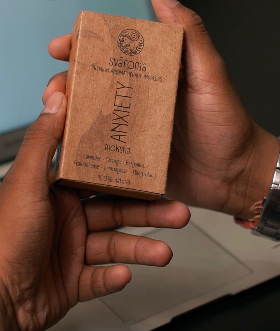 Packaging of the Svaroma anxiety (sva moksha) inhaler in kraft paper packaging, with ingredient (Lavender, orange, bergamot, frankincense, lemongrass, ylang-ylang) mentioned on it. 
