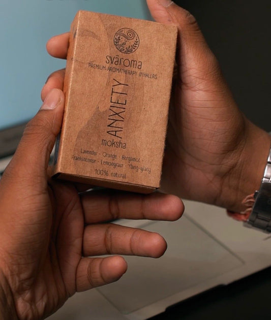 Packaging of the Svaroma anxiety (sva moksha) inhaler in kraft paper packaging, with ingredient (Lavender, orange, bergamot, frankincense, lemongrass, ylang-ylang) mentioned on it. 