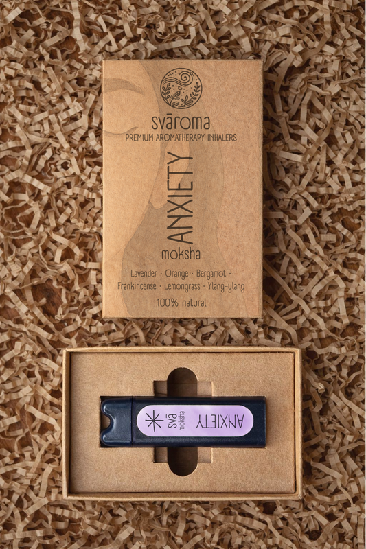 Svaroma Anxiety aromatherapy inhaler in eco-friendly brown box packaging with inhaler device inside, designed for stress relief. Blend includes Lavender, Orange, Frankincense, Bergamot, Ylang-Ylang, and Lemongrass.