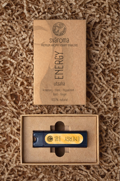 Svaroma Energy aromatherapy inhaler in eco-friendly brown box packaging with inhaler device inside, designed to boost alertness. Blend includes Rosemary, Elemi, Peppermint, Basil, and Ginger.