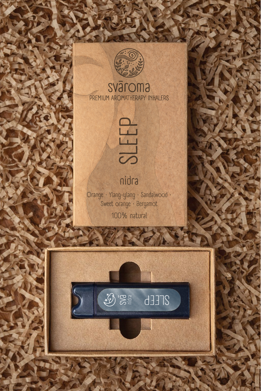 Svaroma Sleep aromatherapy inhaler in eco-friendly brown box packaging, placed on shredded paper fill, with inhaler device visible inside. Blend includes Orange, Ylang-Ylang, Sandalwood, Lavender, Sweet Orange, and Bergamot for natural sleep support.