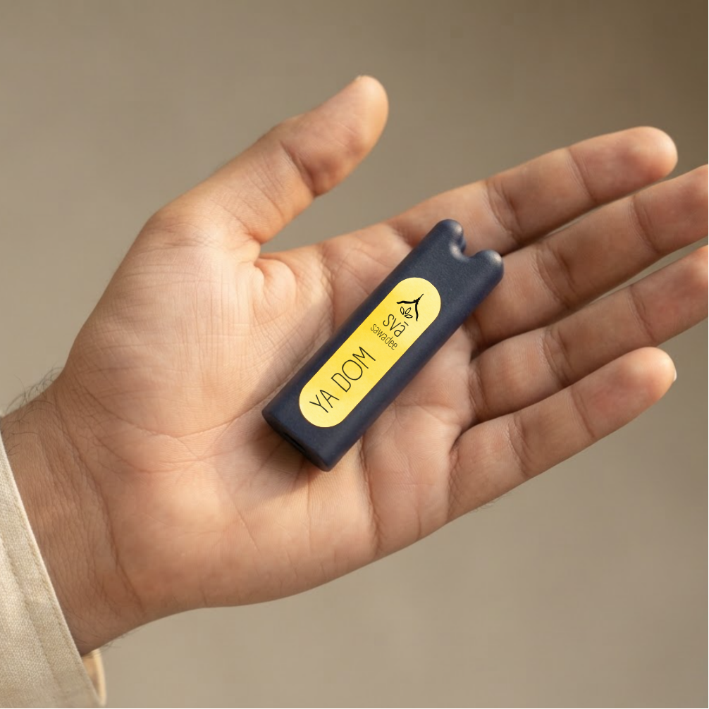 svā sawadee (Ya Dom) Thai inhaler held in hand, showing its sleek, pocket-sized design