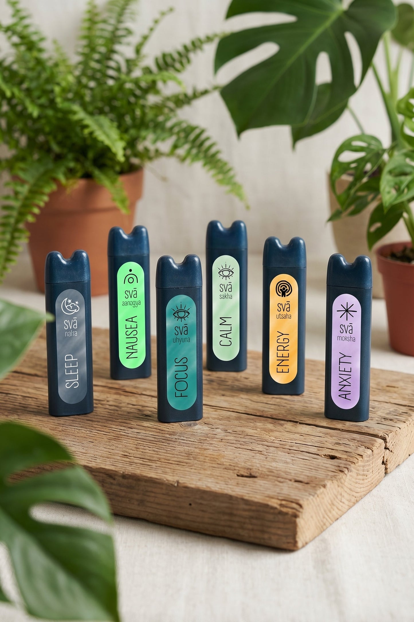 Natural aromatherapy inhalers for focus, calm, energy, sleep, calm, and anxiety relief on wooden surface
