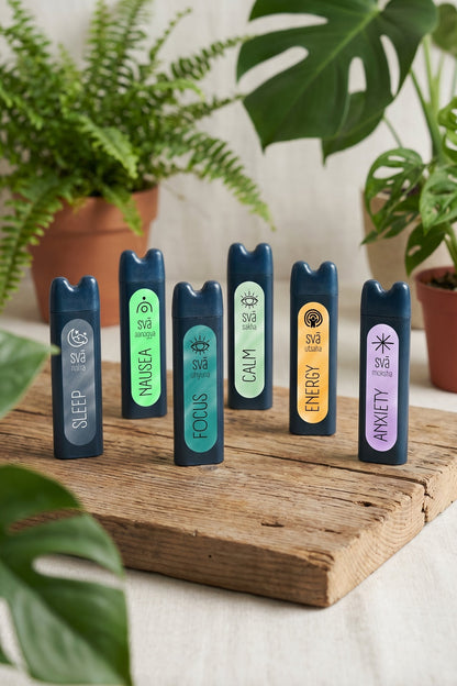 Natural aromatherapy inhalers for focus, calm, energy, sleep, calm, and anxiety relief on wooden surface